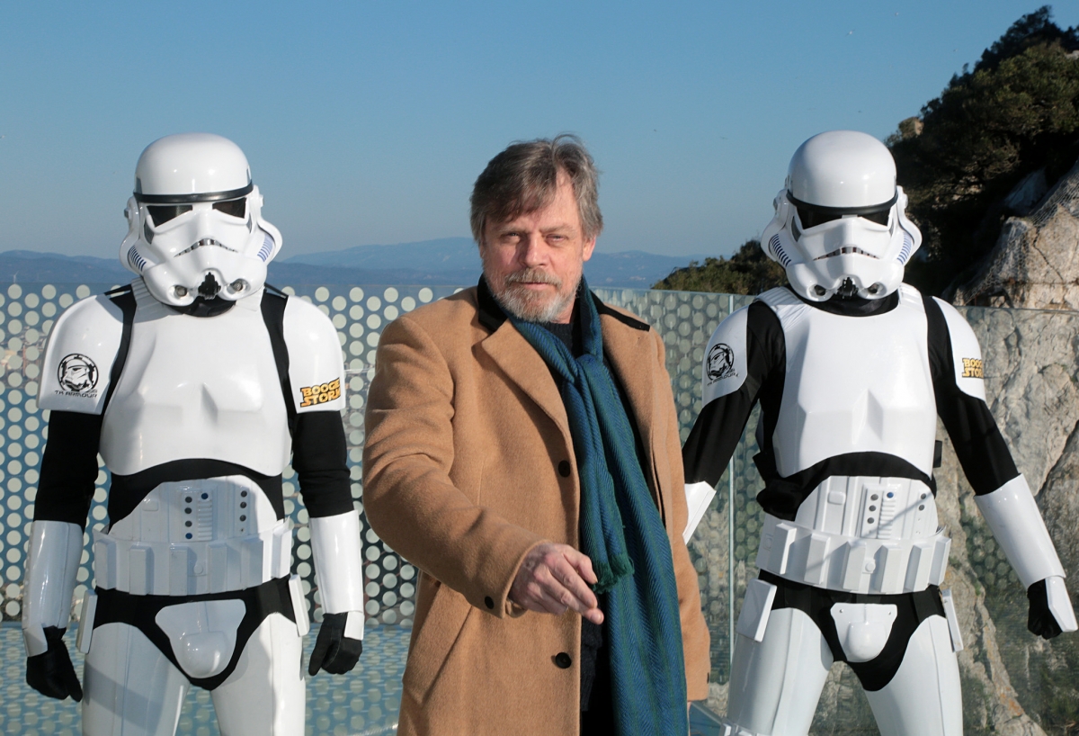 Mark Hamill takes the first steps on the Gibraltar Skywalk, flanked by members of Boogie Storm