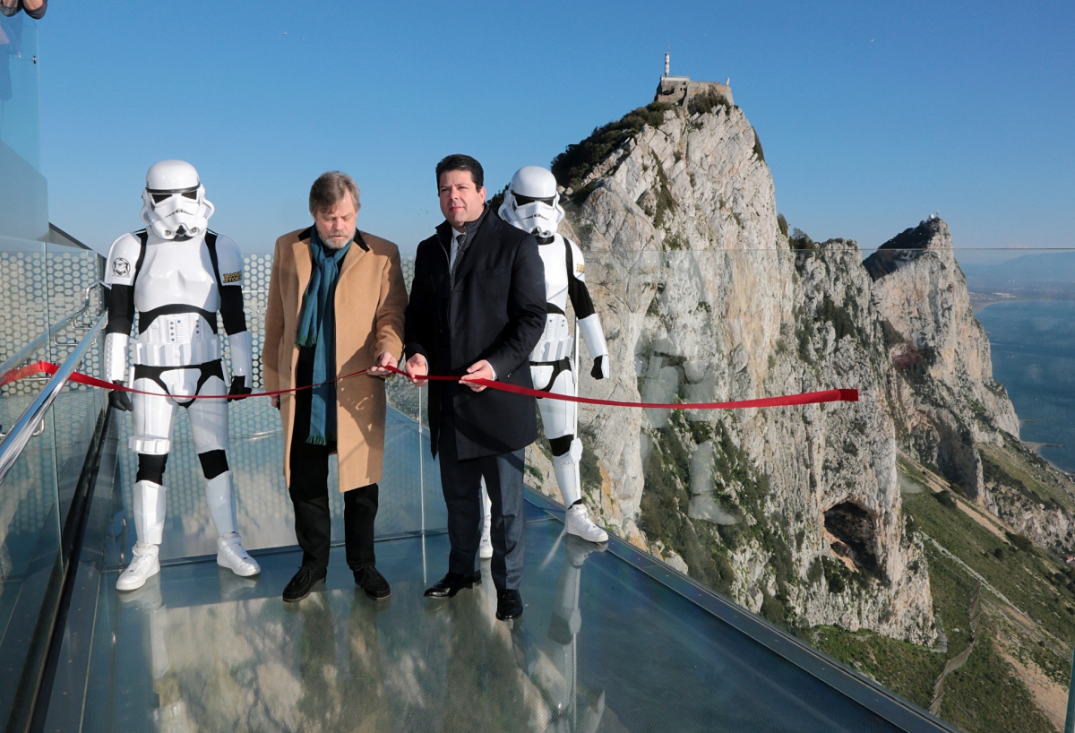 Mark Hamill cuts the red ribbon with a ‘lightsaber’